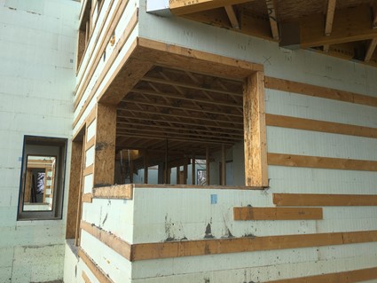 Image of a building being built using ICF and wood.
