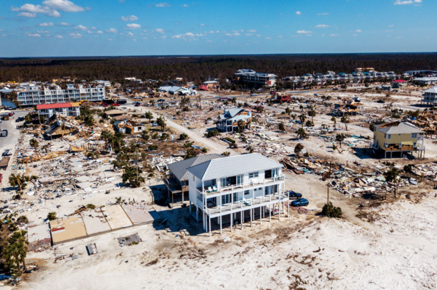 icf beach house surrounded by destroyed homes from hurricane