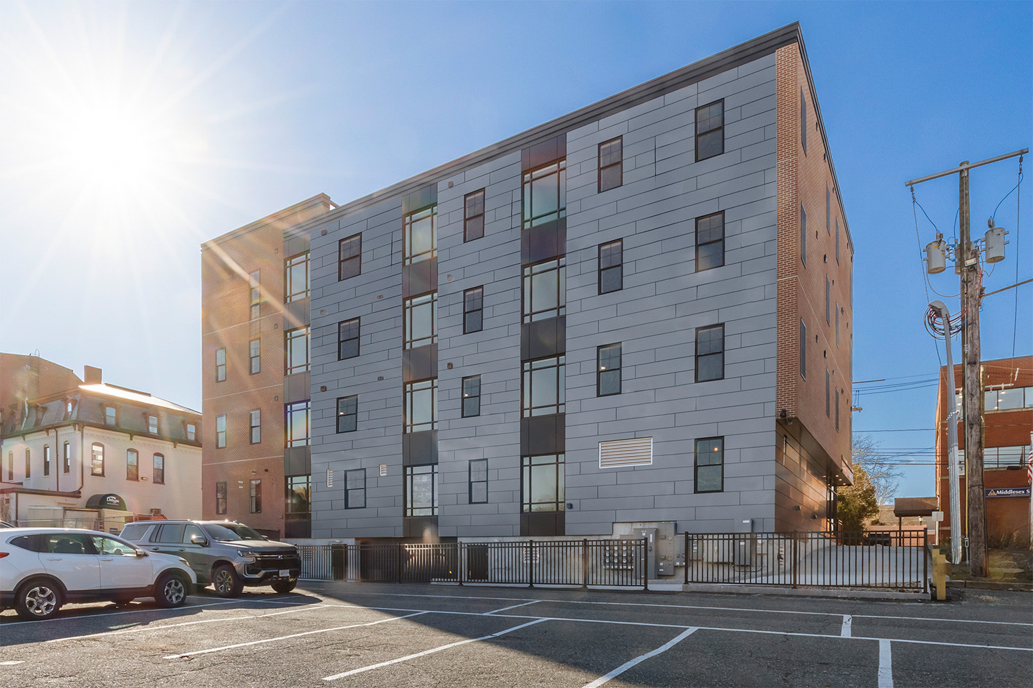 Outside of a brick and metal panel building.