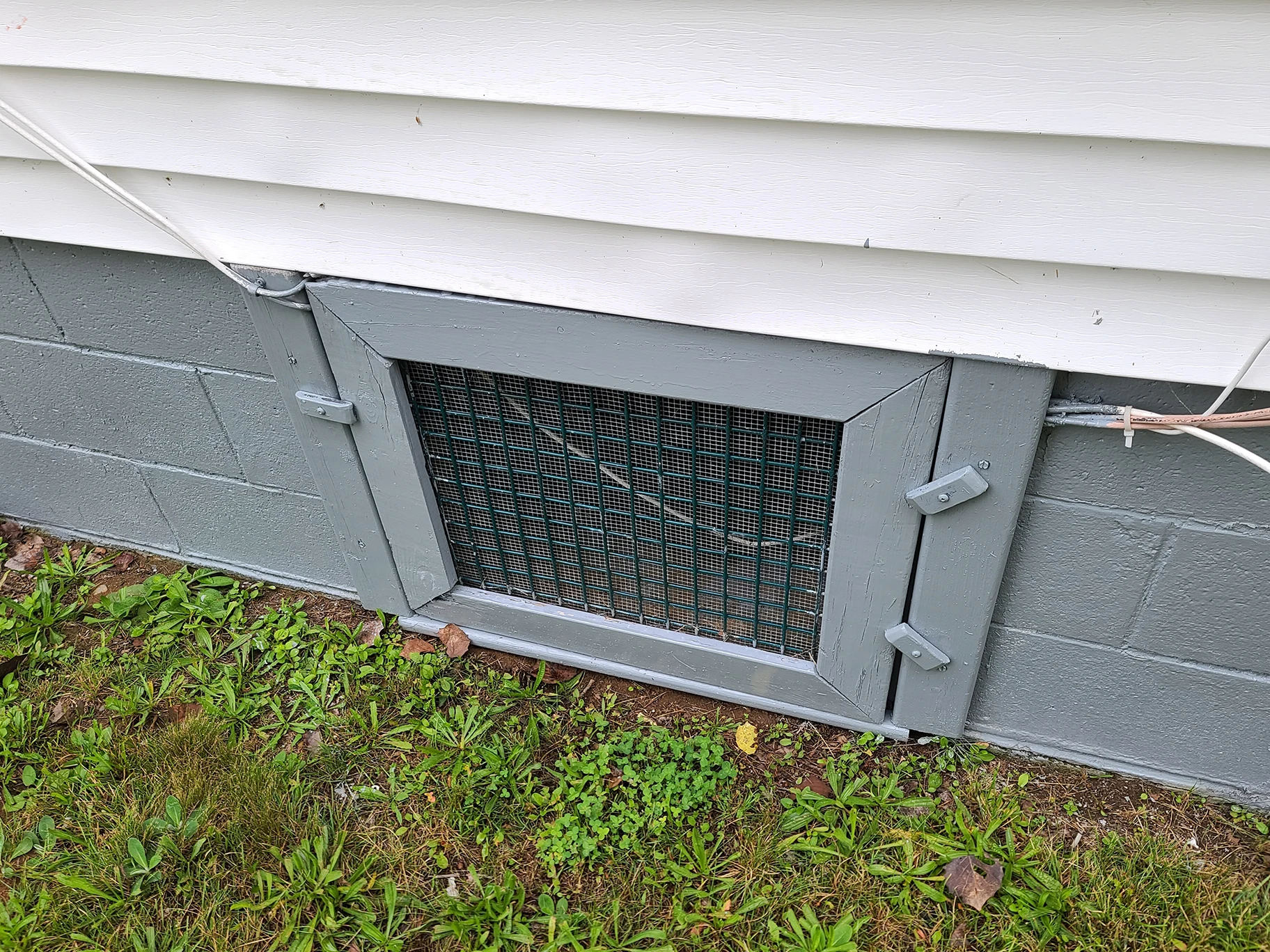 Gray cinder block crawlspace.