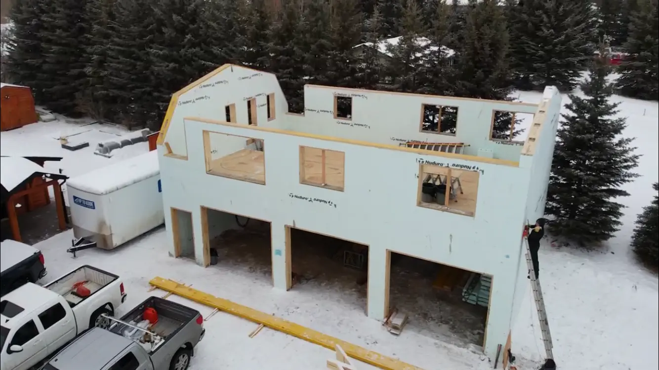 aerial view of icf house with snow