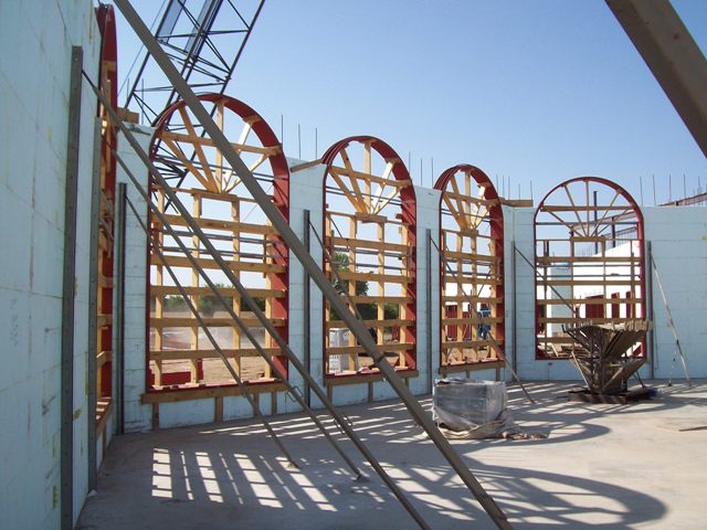 Arched metal window bucks in ICF wall.