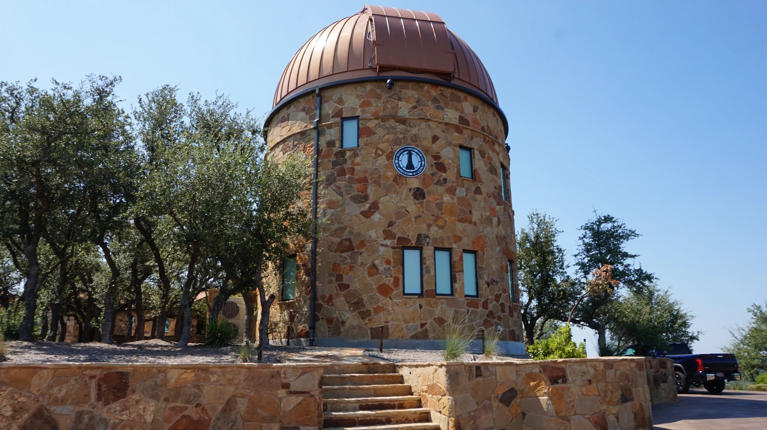 Curved ICF observatory with a stone finish.